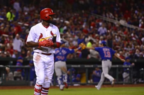 Apr 4, 2017; St. Louis, MO, USA; St. Louis Cardinals center fielder Dexter Fowler (25) walks back to the dugout as Chicago Cubs catcher Willson Contreras (40) and relief pitcher Koji Uehara (19) celebrate after Folwer struck out to end the seventh inning at Busch Stadium. The Cubs won 2-1. Mandatory Credit: Jeff Curry-USA TODAY Sports