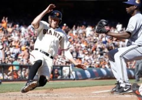 Aug 31, 2014; San Francisco, CA, USA; San Francisco Giants right fielder Hunter Pence (8) scores on a wild pitch by Milwaukee Brewers relief pitcher Alfredo Figaro (45) during the seventh inning at AT&T Park. Mandatory Credit: Bob Stanton-USA TODAY Sports