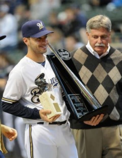 Apr 6, 2013; Milwaukee, WI, USA; Milwaukee Brewers left fielder Ryan Braun (8) receives the Silver Slugger Award from general manager Doug Melvin before game against the Arizona Diamondbacks at Miller Park. Mandatory Credit: Benny Sieu-USA TODAY Sports