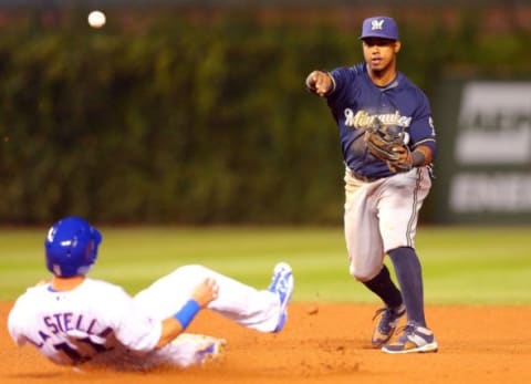 Sep 23, 2015; Chicago, IL, USA; Milwaukee Brewers shortstop Jean Segura (9) forces out Chicago Cubs second baseman Tommy La Stella (11) on the front end of a double play during the eighth inning at Wrigley Field. Milwaukee won 4-1. Mandatory Credit: Dennis Wierzbicki-USA TODAY Sports