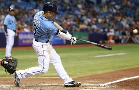 Jul 26, 2015; St. Petersburg, FL, USA; Tampa Bay Rays second baseman Jake Elmore (10) singles during the fifth inning against the Baltimore Orioles at Tropicana Field. The Orioles won 5-2. Mandatory Credit: Kim Klement-USA TODAY Sports