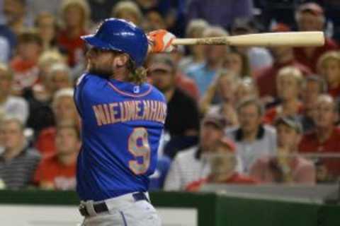 Sep 8, 2015; Washington, DC, USA; New York Mets left fielder Kirk Nieuwenhuis (9) hits a solo home run during the eighth inning against the Washington Nationals at Nationals Park. New York Mets defeated Washington Nationals 8-7. Mandatory Credit: Tommy Gilligan-USA TODAY Sports