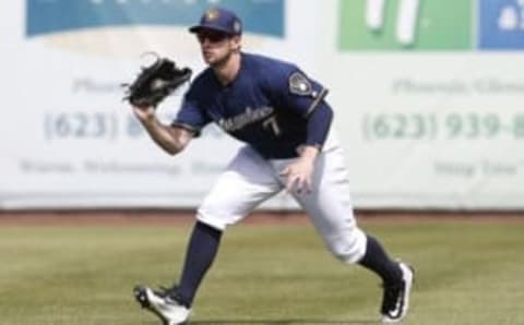 Mar 29, 2016; Phoenix, AZ, USA; Milwaukee Brewers left fielder Alex Presley (7) makes the running catch against the Cincinnati Reds in the fourth inning during a spring training game at Maryvale Baseball Park. Mandatory Credit: Rick Scuteri-USA TODAY Sports