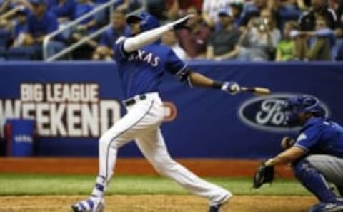 Mar 18, 2016; San Antonio, TX, USA; Texas Rangers center fielder Lewis Brinson (70) hits a three run home run during the ninth inning against the Kansas City Royals at Alamodome. The Rangers defeated the Royals 7-5. Mandatory Credit: Soobum Im-USA TODAY Sports