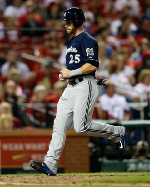 Sep 26, 2015; St. Louis, MO, USA; Milwaukee Brewers’ Michael Reed (25) scores on a single by Jonathan Lucroy (not pictured) during the sixth inning of a baseball game against the St. Louis Cardinals at Busch Stadium. Mandatory Credit: Scott Kane-USA TODAY Sports