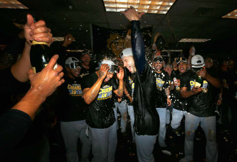 DENVER, CO – OCTOBER 07: Ryan Braun #8 of the Milwaukee Brewers celebrates in the locker room after his team won Game Three to clinch the National League Division Series by defeating the Colorado Rockies at Coors Field on October 7, 2018 in Denver, Colorado. The Brewers won the game 6-0 and the series 3-0. (Photo by Justin Edmonds/Getty Images)