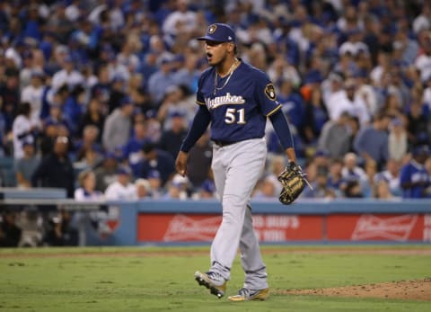 LOS ANGELES, CA – OCTOBER 16: Pitcher Freddy Peralta #51 of the Milwaukee Brewers reacts after striking out Max Muncy #13 of the Los Angeles Dodgers (not in photo) to end the second inning during Game Four of the National League Championship Series at Dodger Stadium on October 16, 2018 in Los Angeles, California. (Photo by Jeff Gross/Getty Images)