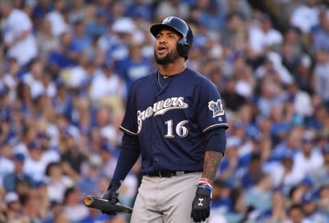 LOS ANGELES, CA – OCTOBER 17: Domingo Santana #16 of the Milwaukee Brewers reacts after striking out swinging during the eighth inning of Game Five of the National League Championship Series against the Los Angeles Dodgers at Dodger Stadium on October 17, 2018 in Los Angeles, California. (Photo by Harry How/Getty Images)