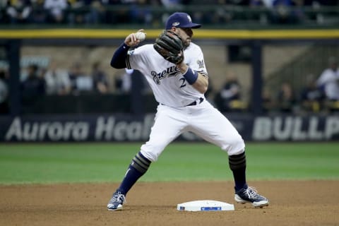 MILWAUKEE, WI – OCTOBER 20: Travis Shaw #21 of the Milwaukee Brewers turns a double play against the Los Angeles Dodgers during the fourth inning in Game Seven of the National League Championship Series at Miller Park on October 20, 2018 in Milwaukee, Wisconsin. (Photo by Jonathan Daniel/Getty Images)