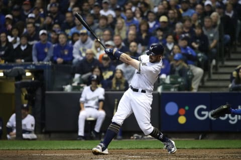 MILWAUKEE, WI – OCTOBER 20: Travis Shaw #21 of the Milwaukee Brewers hits a double missed by Yasiel Puig #66 of the Los Angeles Dodgers during the fourth inning in Game Seven of the National League Championship Series at Miller Park on October 20, 2018 in Milwaukee, Wisconsin. (Photo by Jonathan Daniel/Getty Images)