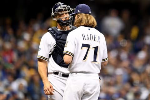 MILWAUKEE, WI – OCTOBER 20: Josh Hader #71 and Erik Kratz #15 of the Milwaukee Brewers talk during the fifth inning against the Los Angeles Dodgers in Game Seven of the National League Championship Series at Miller Park on October 20, 2018 in Milwaukee, Wisconsin. (Photo by Stacy Revere/Getty Images)