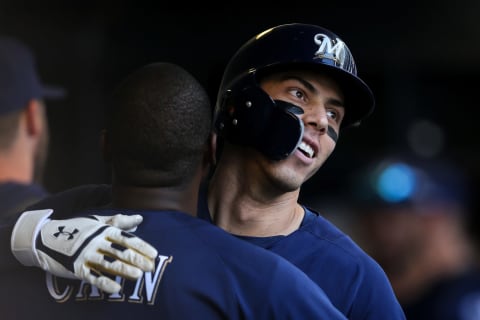 MILWAUKEE, WISCONSIN – JULY 17: Lorenzo Cain #6 and Christian Yelich #22 of the Milwaukee Brewers celebrate after Yelich hit a home run in the sixth inning against the Atlanta Braves at Miller Park on July 17, 2019 in Milwaukee, Wisconsin. (Photo by Dylan Buell/Getty Images)