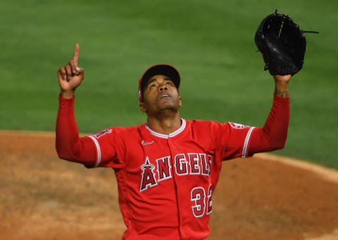 ANAHEIM, CA – JUNE 04: Raisel Iglesias #32 of the Los Angeles Angels celebrates after pitching out of a bases loaded, no outs jam in the eighth inning of the game against the Seattle Mariners at Angel Stadium of Anaheim on June 4, 2021 in Anaheim, California. (Photo by Jayne Kamin-Oncea/Getty Images)