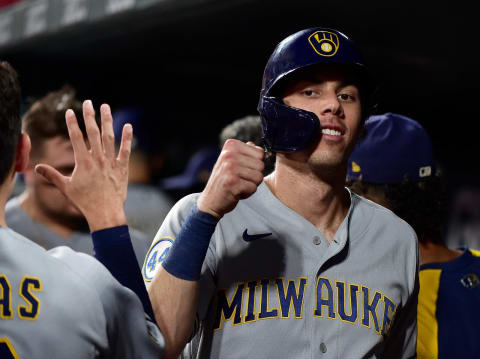 ST LOUIS, MO – SEPTEMBER 29: Christian Yelich #22 of the Milwaukee Brewers celebrates with teammates after scoring a run during the sixth inning against the St. Louis Cardinals at Busch Stadium on September 29, 2021 in St Louis, Missouri. (Photo by Jeff Curry/Getty Images)