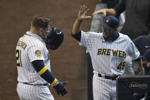 MILWAUKEE, WISCONSIN – SEPTEMBER 20: Daniel Vogelbach #21 of the Milwaukee Brewers celebrates with hitting coach Andy Haines #49 of the Milwaukee Brewers after his two run home run in the first inning against the Kansas City Royals at Miller Park on September 20, 2020 in Milwaukee, Wisconsin. (Photo by Quinn Harris/Getty Images)