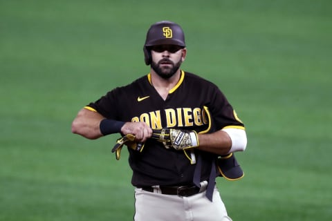 ARLINGTON, TEXAS – OCTOBER 07: Mitch Moreland #18 of the San Diego Padres reacts after hitting an RBI double during the ninth inning against the Los Angeles Dodgers in Game Two of the National League Division Series at Globe Life Field on October 07, 2020 in Arlington, Texas. (Photo by Ronald Martinez/Getty Images)