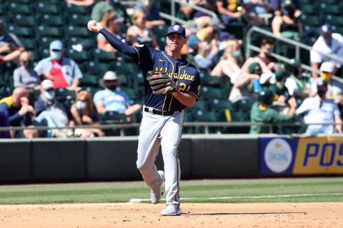 MESA, AZ – MARCH 10: Travis Shaw #21 of the Milwaukee Brewers in action during the game against the Oakland Athletics at Hohokam Park on March 10, 2021 in Mesa, Arizona. The Athletics defeated the Brewers 9-1. (Photo by Rob Leiter/MLB Photos via Getty Images)