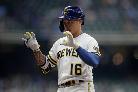 MILWAUKEE, WISCONSIN – MAY 24: Kolten Wong #16 of the Milwaukee Brewers reacts toward the Brewers bench after hitting a single in the seventh inning against the San Diego Padres at American Family Field on May 24, 2021 in Milwaukee, Wisconsin. (Photo by John Fisher/Getty Images)