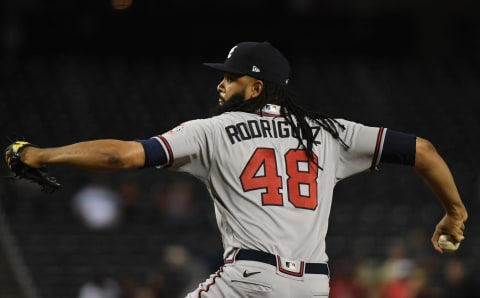 PHOENIX, ARIZONA – SEPTEMBER 20: Richard Rodriguez #48 of the Atlanta Braves delivers a pitch against the Arizona Diamondbacks at Chase Field on September 20, 2021 in Phoenix, Arizona. (Photo by Norm Hall/Getty Images)