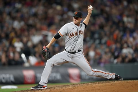 DENVER, COLORADO – SEPTEMBER 24: Tony Watson #56 of the San Francisco Giants throws against of the Colorado Rockies in the seventh inning at Coors Field on September 24, 2021 in Denver, Colorado. (Photo by Matthew Stockman/Getty Images