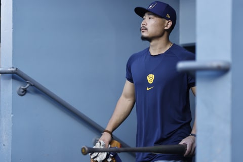 LOS ANGELES, CALIFORNIA – OCTOBER 01: #18 of the Milwaukee Brewers takes the field prior to a game against the Los Angeles Dodgers at Dodger Stadium on October 01, 2021 in Los Angeles, California. (Photo by Michael Owens/Getty Images)