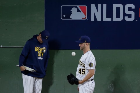 MILWAUKEE, WISCONSIN – OCTOBER 09: Brad Boxberger #45 of the Milwaukee Brewers watches the game from the bullpen during game 2 of the National League Division Series at American Family Field on October 09, 2021 in Milwaukee, Wisconsin. Braves defeated the Brewers 3-0. (Photo by John Fisher/Getty Images)