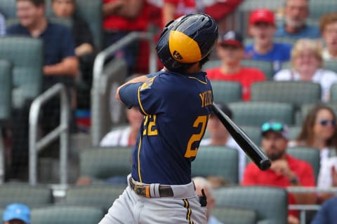 ATLANTA, GEORGIA – OCTOBER 12: Christian Yelich #22 of the Milwaukee Brewers bats during the first inning against the Atlanta Braves in game four of the National League Division Series at Truist Park on October 12, 2021 in Atlanta, Georgia. (Photo by Kevin C. Cox/Getty Images)