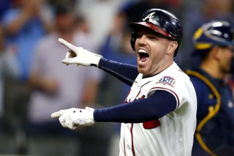 ATLANTA, GEORGIA – OCTOBER 12: Freddie Freeman #5 of the Atlanta Braves reacts after hitting a home run during the eighth inning against the Milwaukee Brewers in game four of the National League Division Series at Truist Park on October 12, 2021 in Atlanta, Georgia. (Photo by Michael Zarrilli/Getty Images)