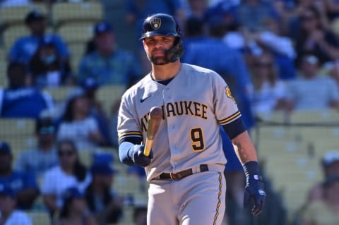 LOS ANGELES, CALIFORNIA – OCTOBER 03: Manny Pina #9 of the Milwaukee Brewers bats against the Los Angeles Dodgers at Dodger Stadium on October 03, 2021 in Los Angeles, California. (Photo by Jonathan Moore/Getty Images)