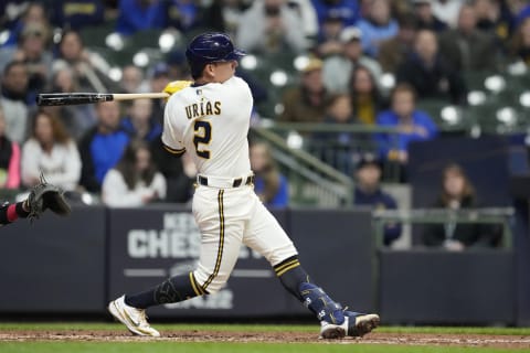 MILWAUKEE, WISCONSIN – MAY 03: Luis Urias #2 of the Milwaukee Brewers hits an RBI single against the Cincinnati Reds in the fourth inning at American Family Field on May 03, 2022 in Milwaukee, Wisconsin. (Photo by Patrick McDermott/Getty Images)