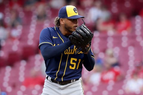 CINCINNATI, OHIO – MAY 10: Freddy Peralta #51 of the Milwaukee Brewers pitches in the third inning against the Cincinnati Reds at Great American Ball Park on May 10, 2022 in Cincinnati, Ohio. (Photo by Dylan Buell/Getty Images)