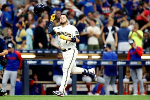 MILWAUKEE, WISCONSIN – JULY 04: Victor Caratini #7 of the Milwaukee Brewers flips his helmet before crossing home plate on his walk-off, three-run home run in the 10th inning against the Chicago Cubs at American Family Field on July 04, 2022 in Milwaukee, Wisconsin. (Photo by John Fisher/Getty Images)