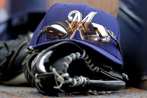 MILWAUKEE, WI – MAY 23: Norichika Aoki’s of the Milwaukee Brewers sunglasses, cap and glove sit on the steps on the Brewers dugout during during the sausage races in the game against the San Francisco Giants at Miller Park on May 23, 2012 in Milwaukee, Wisconsin. (Photo by Mike McGinnis/Getty Images)