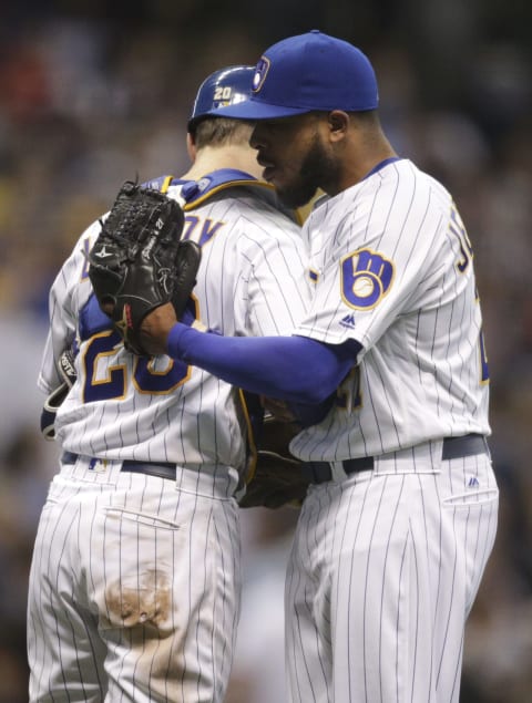 MILWAUKEE, WI – JULY 29: Jonathan Lucroy #20 of the Milwaukee Brewers hugs Jeremy Jeffress #21 of the Milwaukee Brewers after there game against the Pittsburgh Pirates at Miller Park on July 29, 2016 in Milwaukee, Wisconsin. The Brewers defeated the Pirates 3-1. (Photo by John Konstantaras/Getty Images)