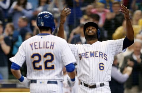 MILWAUKEE, WI – APRIL 22: Christian Yelich #22 and Lorenzo Cain #6 of the Milwaukee Brewers celebrate after Yelich hit a home run in the fourth inning against the Miami Marlins at Miller Park on April 22, 2018 in Milwaukee, Wisconsin. (Photo by Dylan Buell/Getty Images)