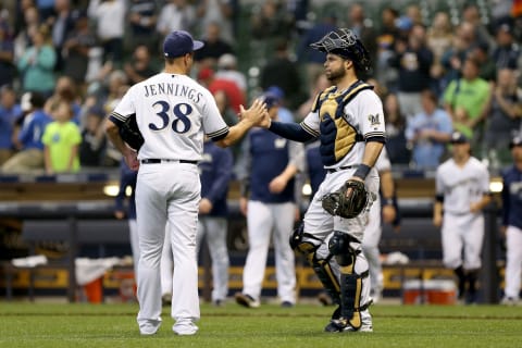 MILWAUKEE, WI – JUNE 21: Dan Jennings #38 and Manny Pina #9 of the Milwaukee Brewers celebrate after beating the St. Louis Cardinals 11-3 at Miller Park on June 21, 2018 in Milwaukee, Wisconsin. (Photo by Dylan Buell/Getty Images)