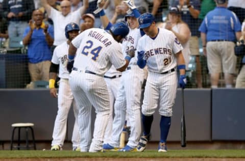 MILWAUKEE, WI – JULY 06: Jesus Aguilar #24 and Travis Shaw #21 of the Milwaukee Brewers celebrate after Aguilar hit a home run in the third inning against the Atlanta Braves at Miller Park on July 6, 2018 in Milwaukee, Wisconsin. (Photo by Dylan Buell/Getty Images)