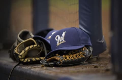 MILWAUKEE, WI – APRIL 7: Milwaukee Brewers ball cap and gloves are left on the dugout steps during the game against the San Francisco Giants at Miller Park on April 18, 2013 in Milwaukee, Wisconsin. (Photo by Tom Lynn/Getty Images)