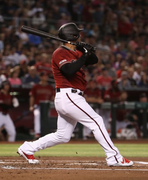 PHOENIX, ARIZONA – JULY 21: Eduardo Escobar #5 of the Arizona Diamondbacks hits a single against the Milwaukee Brewers during the first inning of the MLB game at Chase Field on July 21, 2019 in Phoenix, Arizona. (Photo by Christian Petersen/Getty Images)