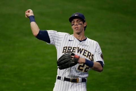 MILWAUKEE, WISCONSIN – OCTOBER 09: Christian Yelich #22 of the Milwaukee Brewers warms up during game 2 of the National League Division Series at American Family Field on October 09, 2021 in Milwaukee, Wisconsin. Braves defeated the Brewers 3-0. (Photo by John Fisher/Getty Images)