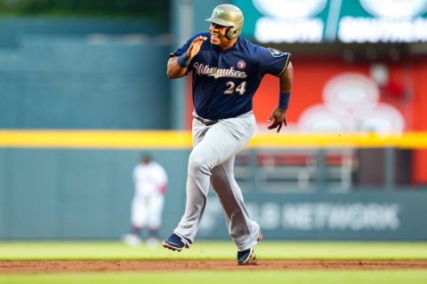 ATLANTA, GA – MAY 18: Jesus Aguilar #24 of the Milwaukee Brewers runs to third base on double hit by Yasmani Grandal #10 in the first inning during the game against the Atlanta Braves at SunTrust Park on May 18, 2019 in Atlanta, Georgia. (Photo by Carmen Mandato/Getty Images)