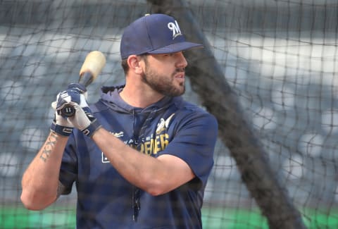 Aug 7, 2019; Pittsburgh, PA, USA; Milwaukee Brewers third baseman Mike Moustakas (11) in the batting cage before playing the Pittsburgh Pirates at PNC Park. Mandatory Credit: Charles LeClaire-USA TODAY Sports