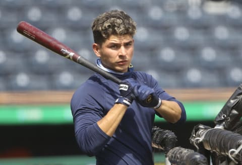 Aug 22, 2020; Pittsburgh, Pennsylvania, USA; Milwaukee Brewers second baseman Luis Urias (2) looks on at the batting cage before playing the Pittsburgh Pirates at PNC Park. Mandatory Credit: Charles LeClaire-USA TODAY Sports