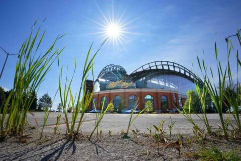 Weeds grow in an empty parking lot at Miller Park in Milwaukee on Thursday, July 30, 2020. With no fans in the stands due to COVID there’ll be no tailgating before Friday’s home opener at Miller Park against the Cardinals.