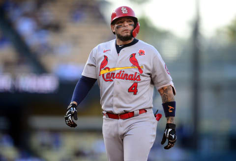 May 31, 2021; Los Angeles, California, USA; St. Louis Cardinals catcher Yadier Molina (4) reacts after Los Angeles Dodgers center fielder Cody Bellinger (35) catches a hit which results in him out during the second inning at Dodger Stadium. Mandatory Credit: Gary A. Vasquez-USA TODAY Sports