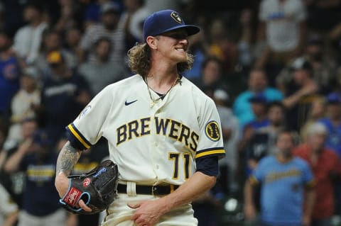 Jun 29, 2021; Milwaukee, Wisconsin, USA; Milwaukee Brewers relief pitcher Josh Hader (71) grimaces as he misses on a pitch against the Chicago Cubs in the ninth inning at American Family Field. Mandatory Credit: Michael McLoone-USA TODAY Sports