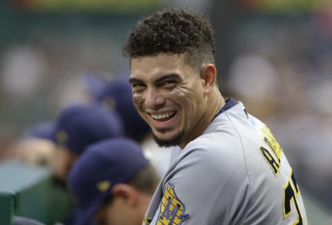 Jul 1, 2021; Pittsburgh, Pennsylvania, USA; Milwaukee Brewers shortstop Willy Adames (27) reacts in the dugout against the Pittsburgh Pirates during the fourth inning at PNC Park. Mandatory Credit: Charles LeClaire-USA TODAY Sports