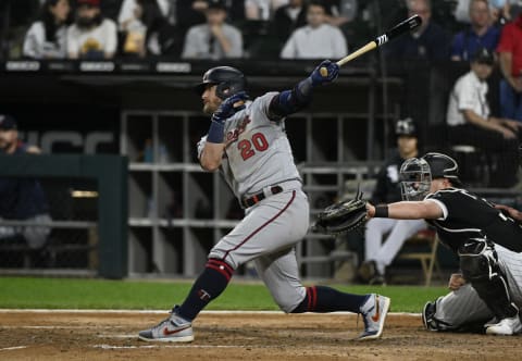 Jul 21, 2021; Chicago, Illinois, USA; Minnesota Twins third baseman Josh Donaldson (20) hits a two RBI single against the Chicago White Sox during the fifth inning at Guaranteed Rate Field. Mandatory Credit: Matt Marton-USA TODAY Sports