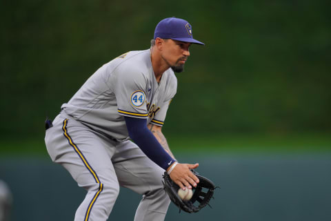 Aug 28, 2021; Minneapolis, Minnesota, USA; Milwaukee Brewers third baseman Jace Peterson (14) fields a ground ball against the Minnesota Twins in the first inning at Target Field. Mandatory Credit: Brad Rempel-USA TODAY Sports