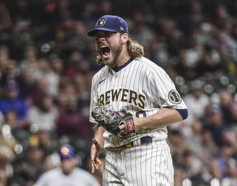 Sep 25, 2021; Milwaukee, Wisconsin, USA; Milwaukee Brewers pitcher Corbin Burnes (39) reacts after retiring the side in the seventh inning during the game against the New York Mets at American Family Field. Mandatory Credit: Benny Sieu-USA TODAY Sports